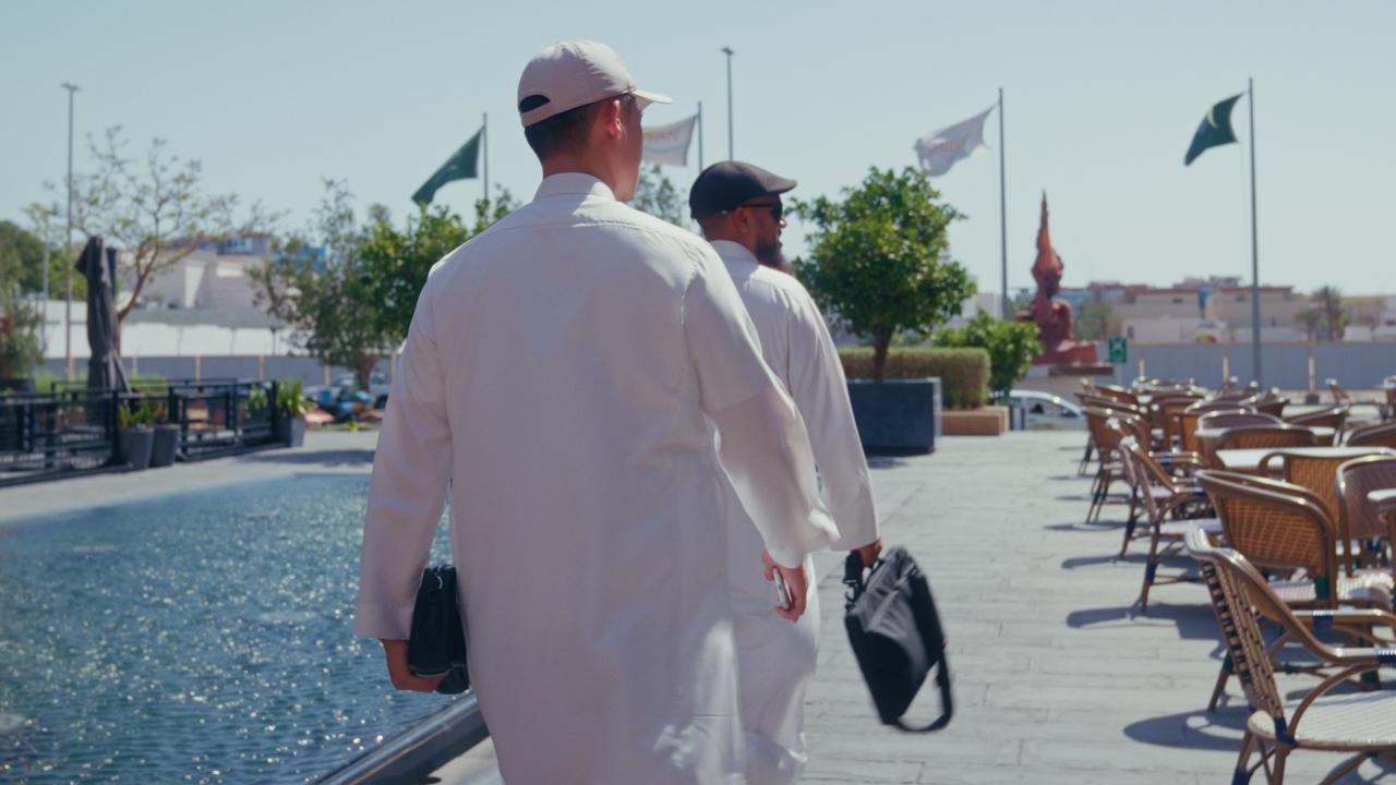 JC Group founders walking along a Riyadh boulevard